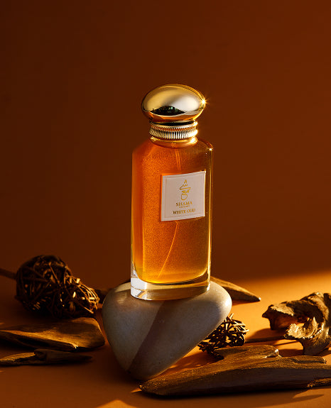 Shama perfume in warm amber light
